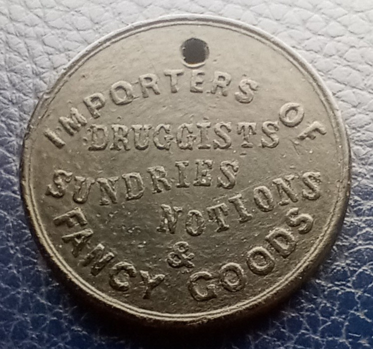 Fosdick, Mitchell & Hild Druggist - Baltimore , MD - Token / Coin Black Plastic