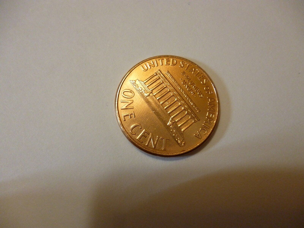 2000 penny, Floating roof coin