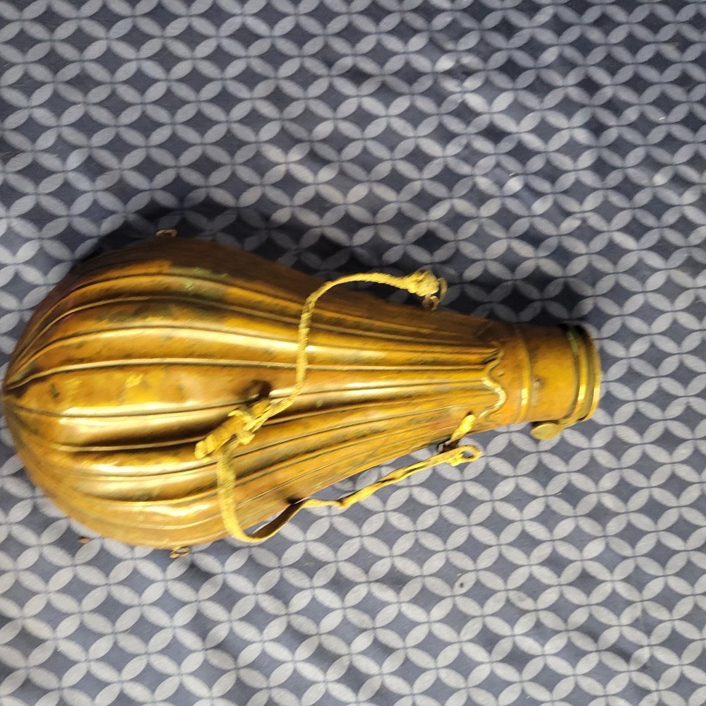 1800's original powder flask large dent on front. tip may be missing.
