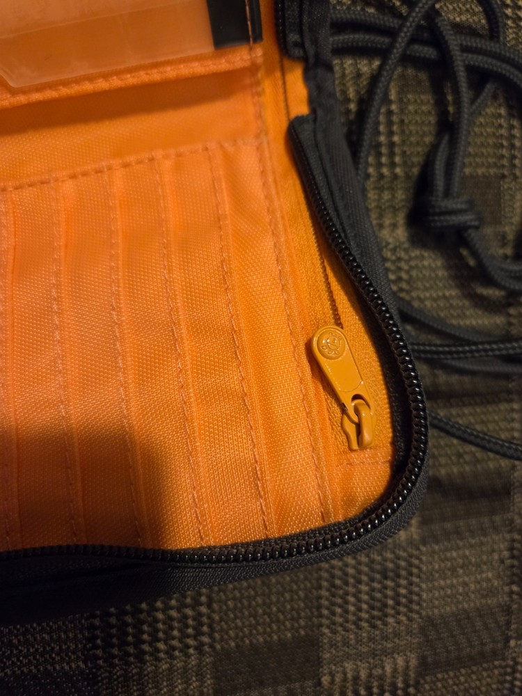 Pacsafe® RFIDsafe™ RFID blocking compact travel organizer, gray (orange inside)