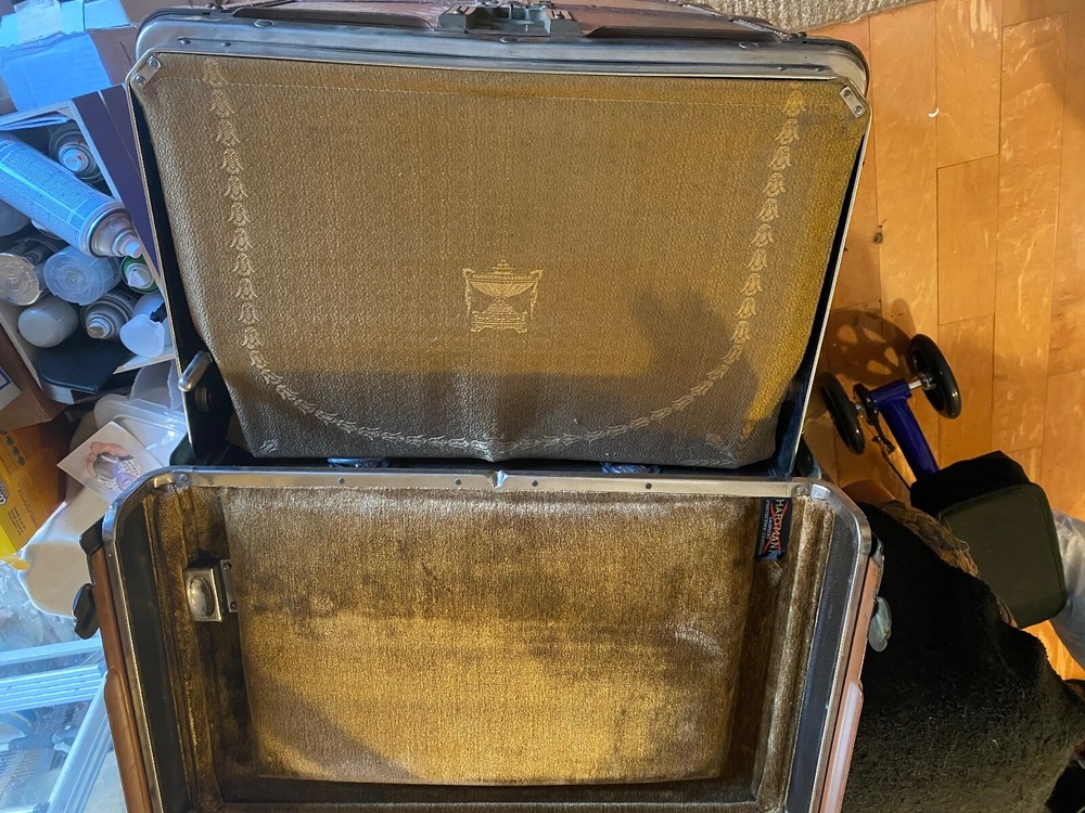 Immaculate early 1900 Hartman upright steamer trunk/cushion top.