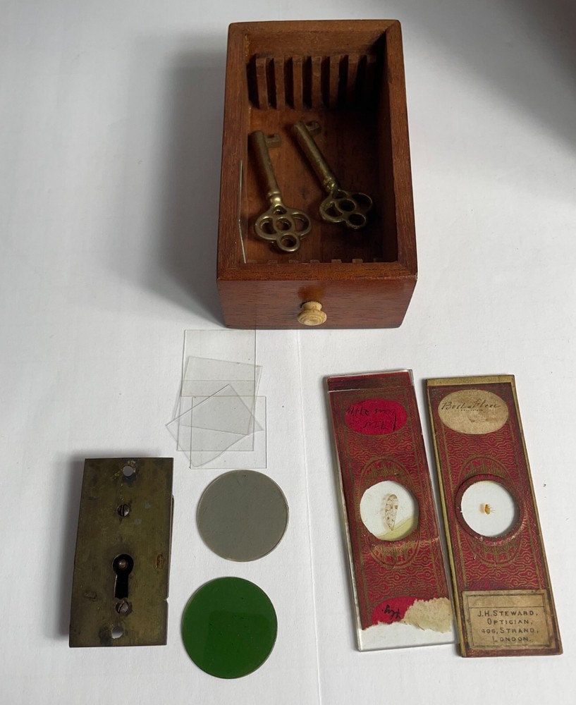 Antique Signed J.H. Steward microscope with case and some accessories.