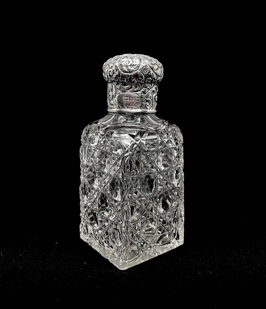 Edwardian sterling silver topped perfume bottle