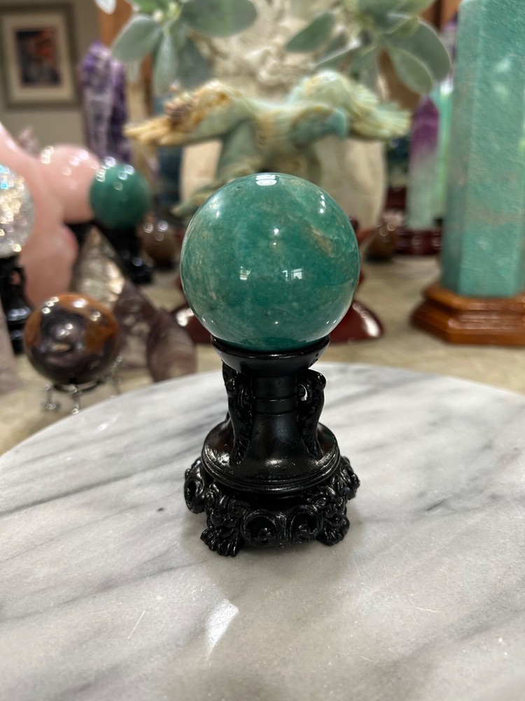 Amazonite high grade sphere with black resin stand 2.11”