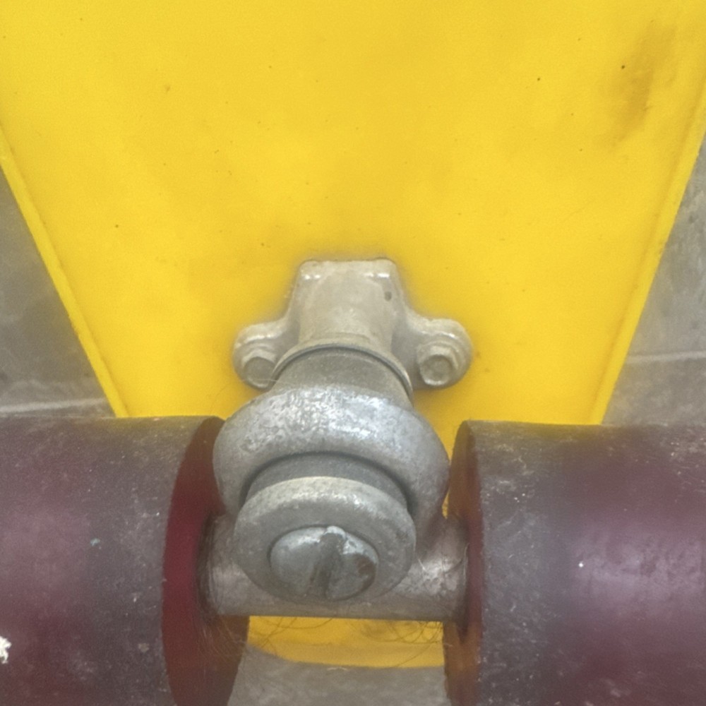 Silver Skateboard Trucks Red Wheels Mounted on Yellow Deck