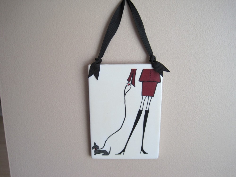 Lady with a dachshund tile.