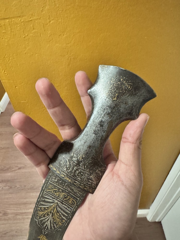 antique dagger with gold and silver engravings