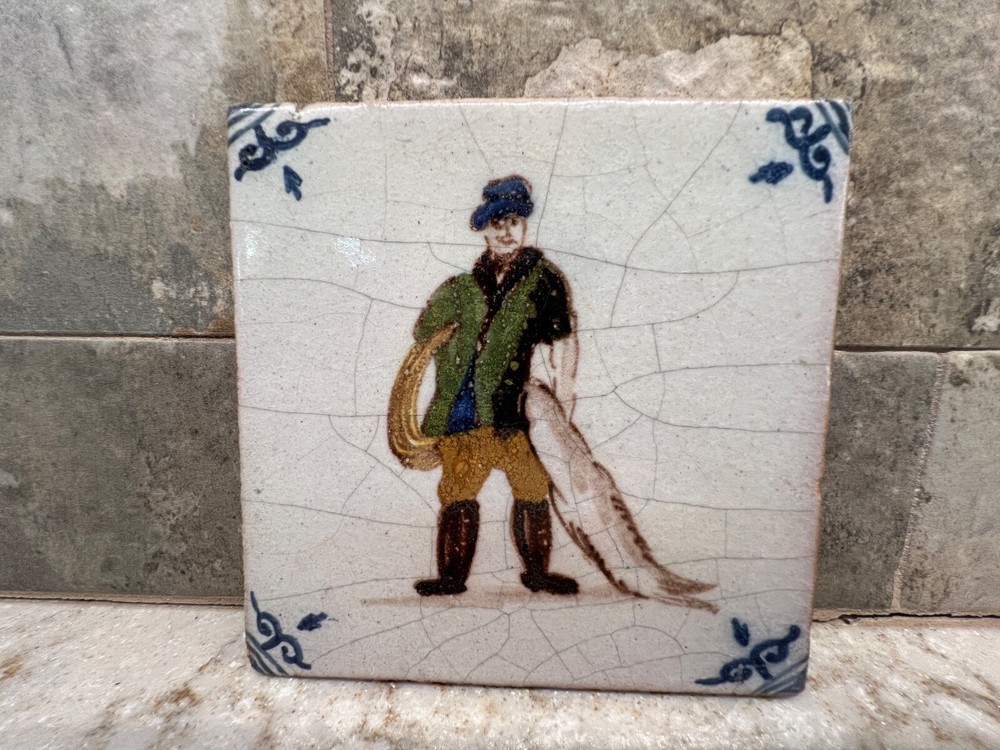 Hand Made Pottery Man With Fish Tile