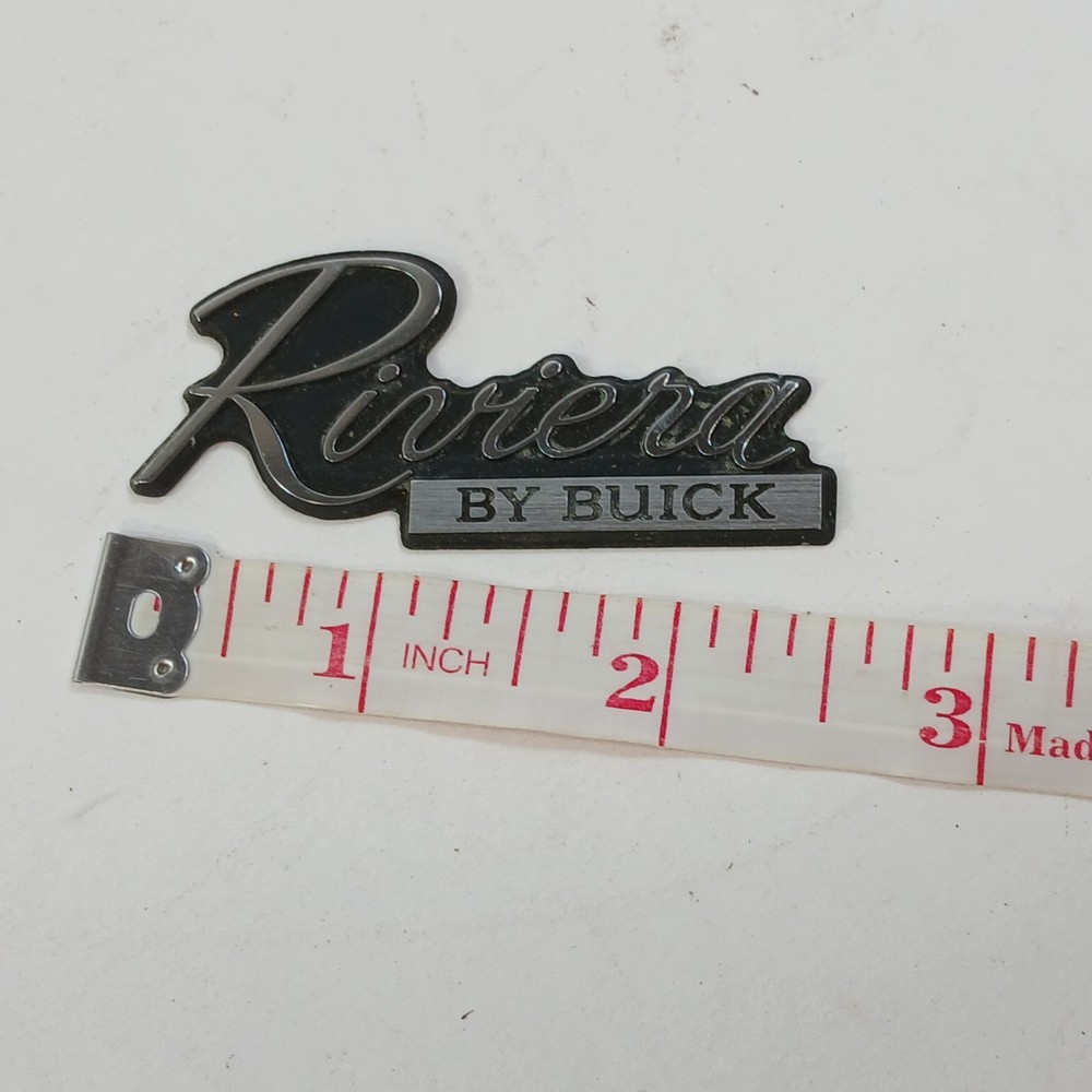 RIVIERA BY BUICK CIRCA '80'S DASH PLASTIC EMBLEM