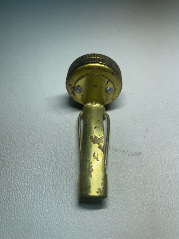 Vintage brass pin on compass
