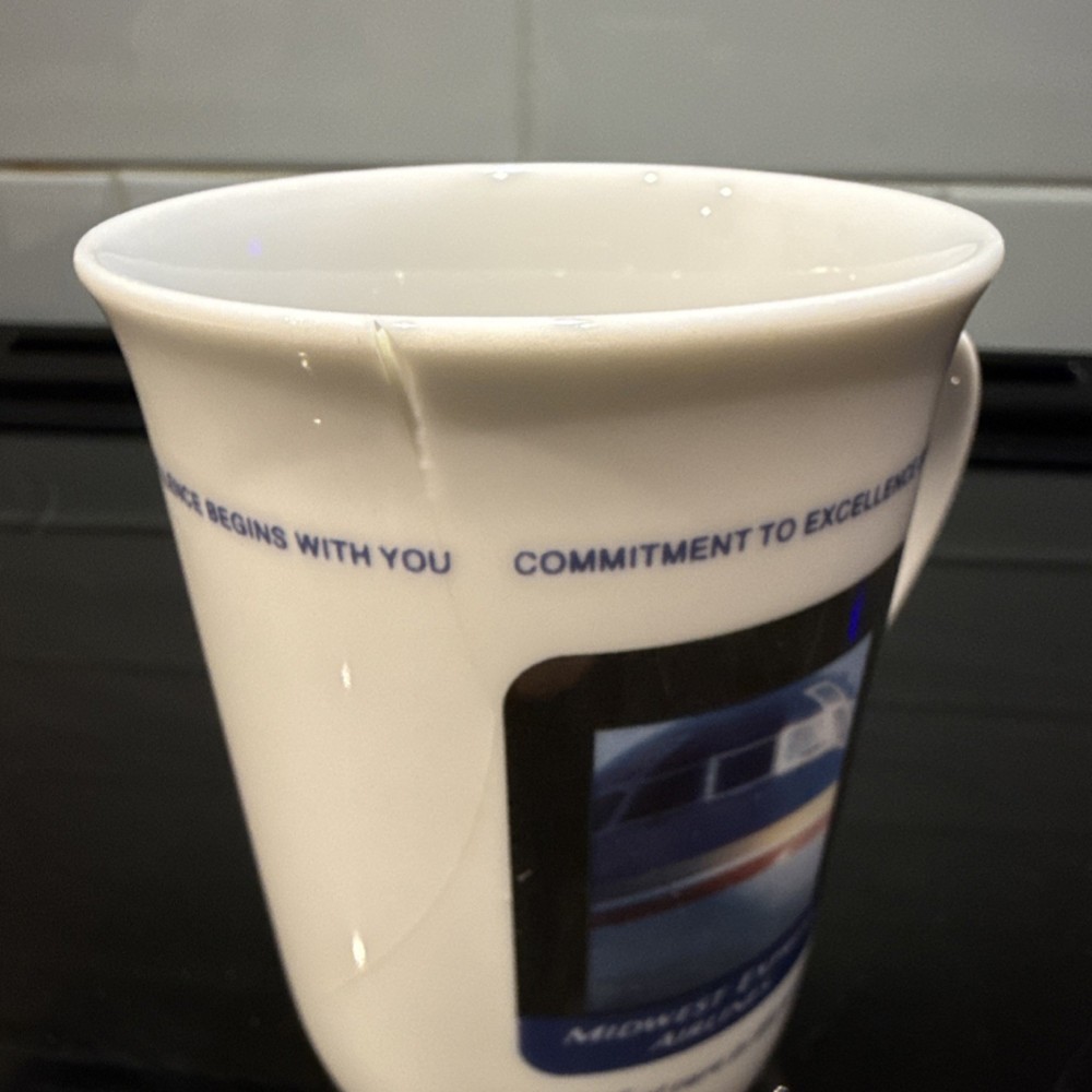 Midwest Express Airlines Collectible Mug White Plane Image Commitment Slogan