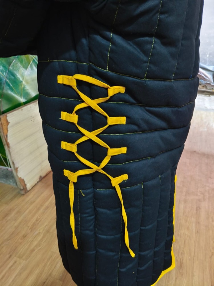 medieval thick padded gambeson black with yellow trim.