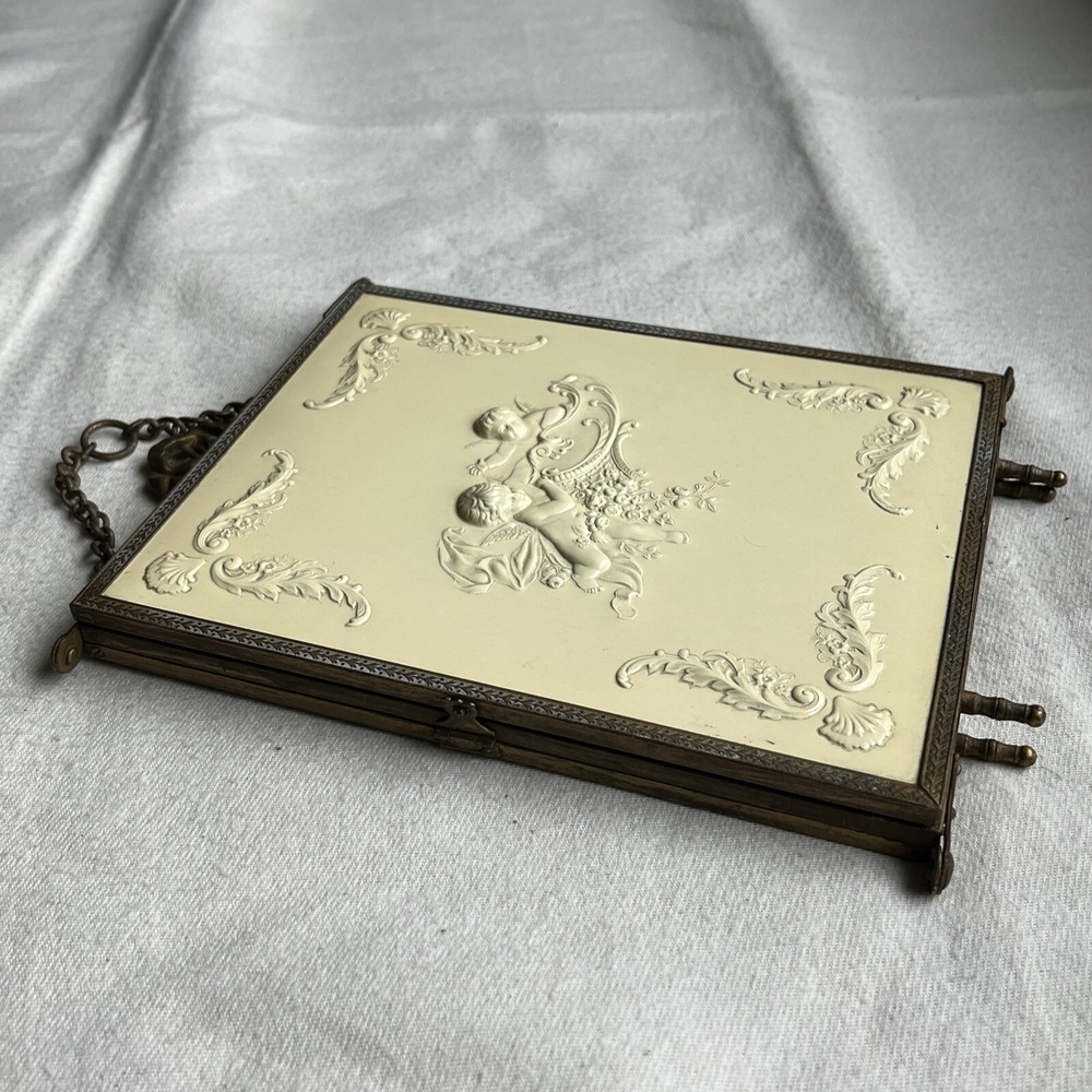 Antique Brass Tri-Fold Celluloid Cherub Hanging Vanity Mirror