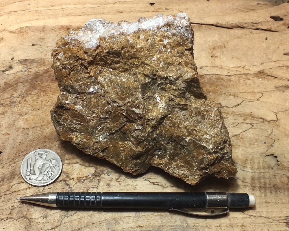 calcite - massive naturally brown calcite - hand/display specimen