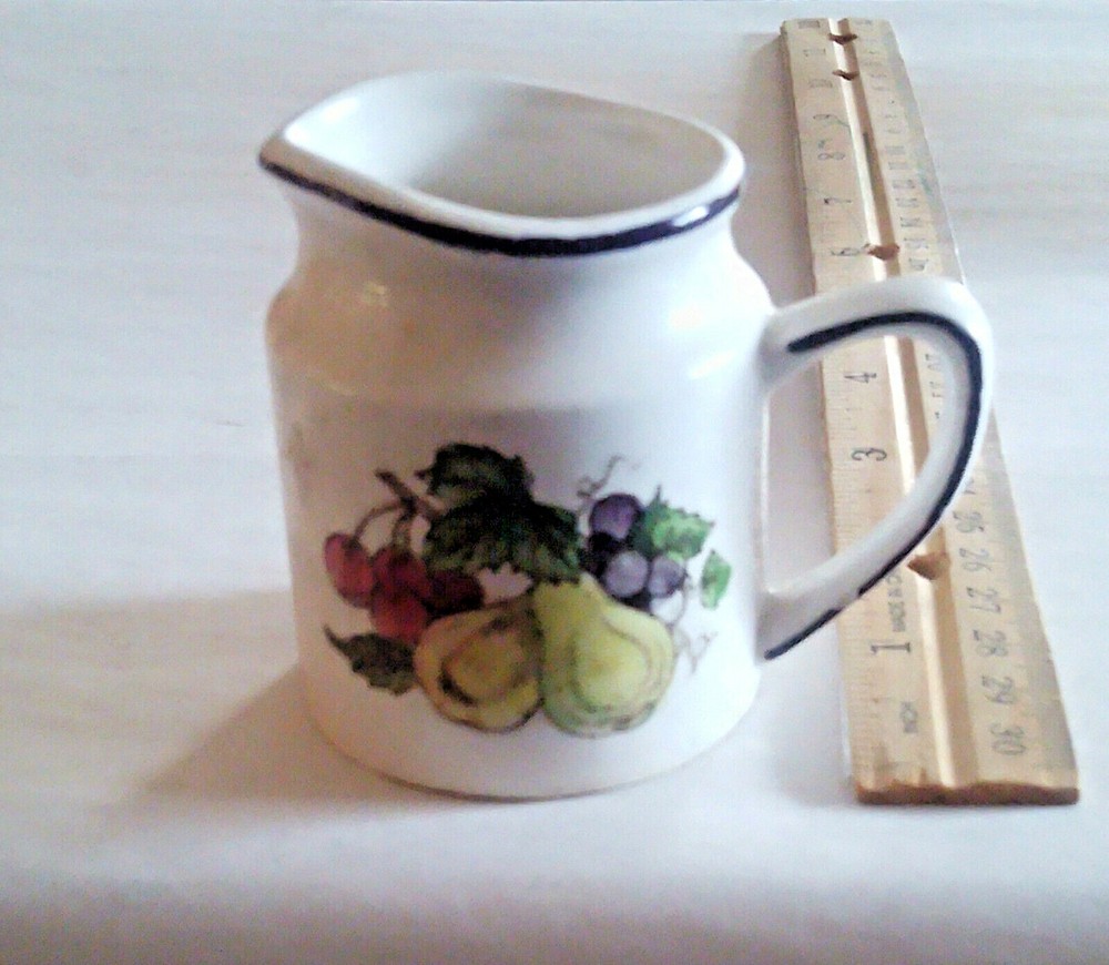 Porcelain Creamer 1/2 Cup marked on Bottom.