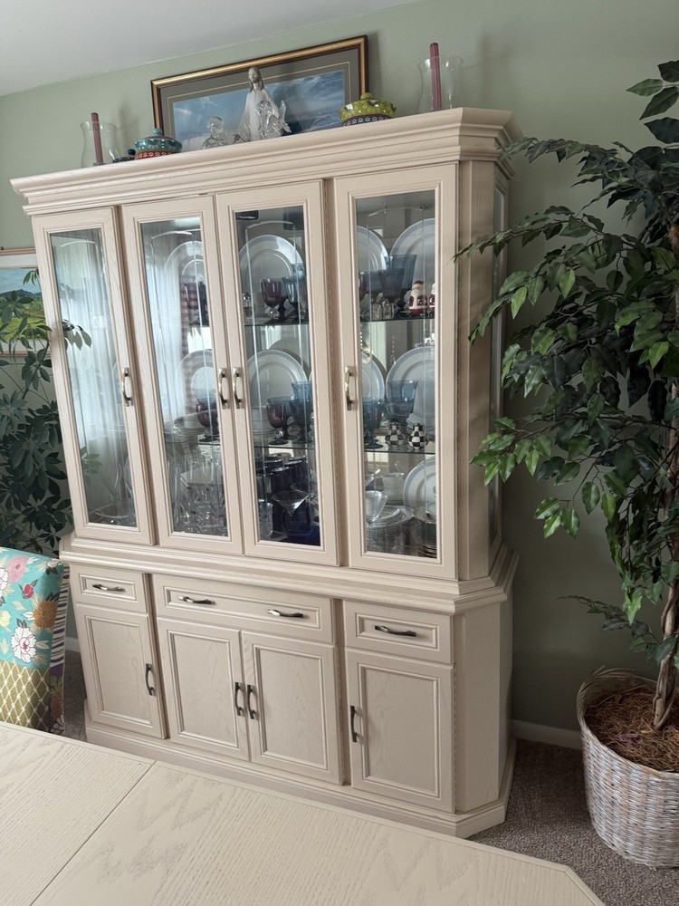 dining room set 6 chairs and lighted hutch ,table has leaf stored inside