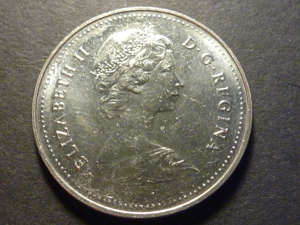 Error: Canada 1982 BU Voyageur nickel $1 with strike-through errors both sides