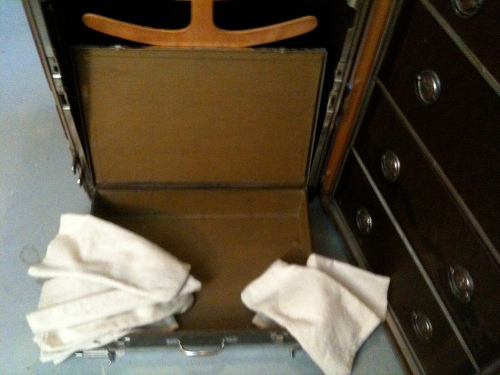 Immaculate early 1900 Hartman upright steamer trunk/cushion top.