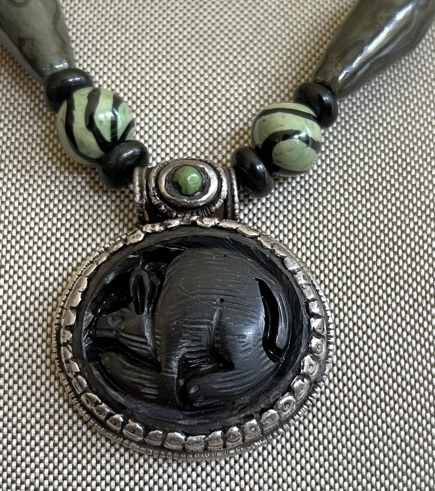 hand crafted beaded necklace Whit Carved Pendant