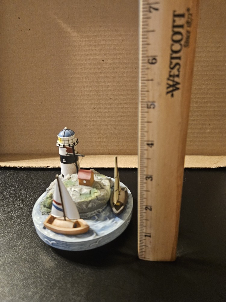 vintage nautical-themed ceramic candle topper