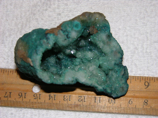 Geode cut & polished half with colored crystal center 3 inch E53