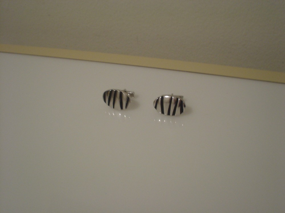 oval silvertone & black oval cufflinks