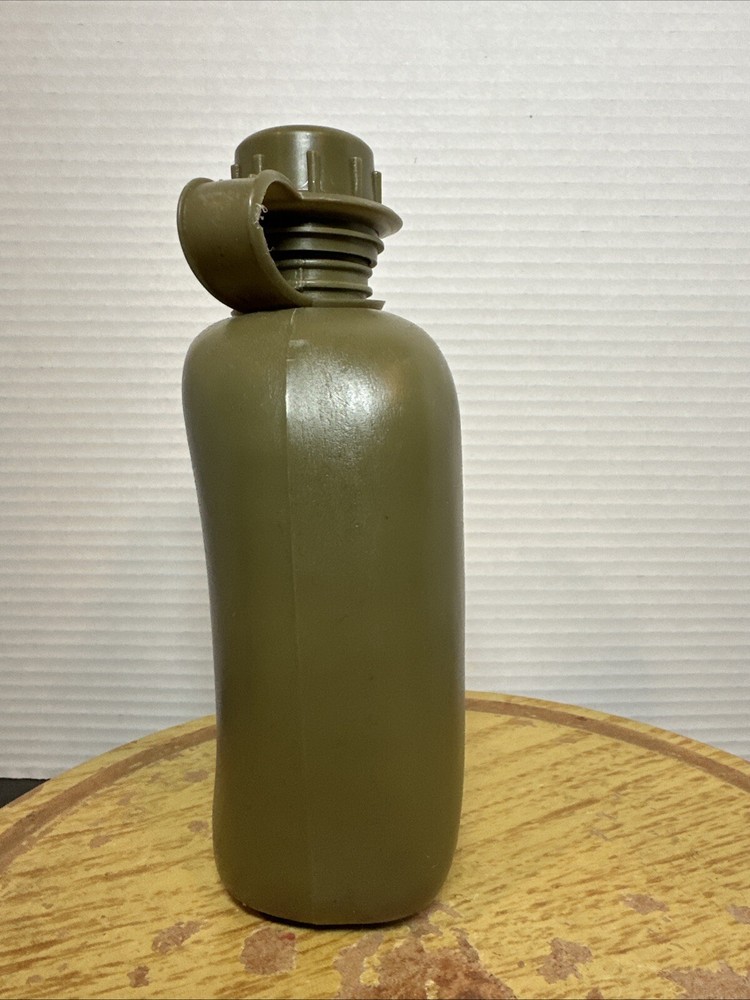 8" Green Plastic Canteen with Cloth Cover.
