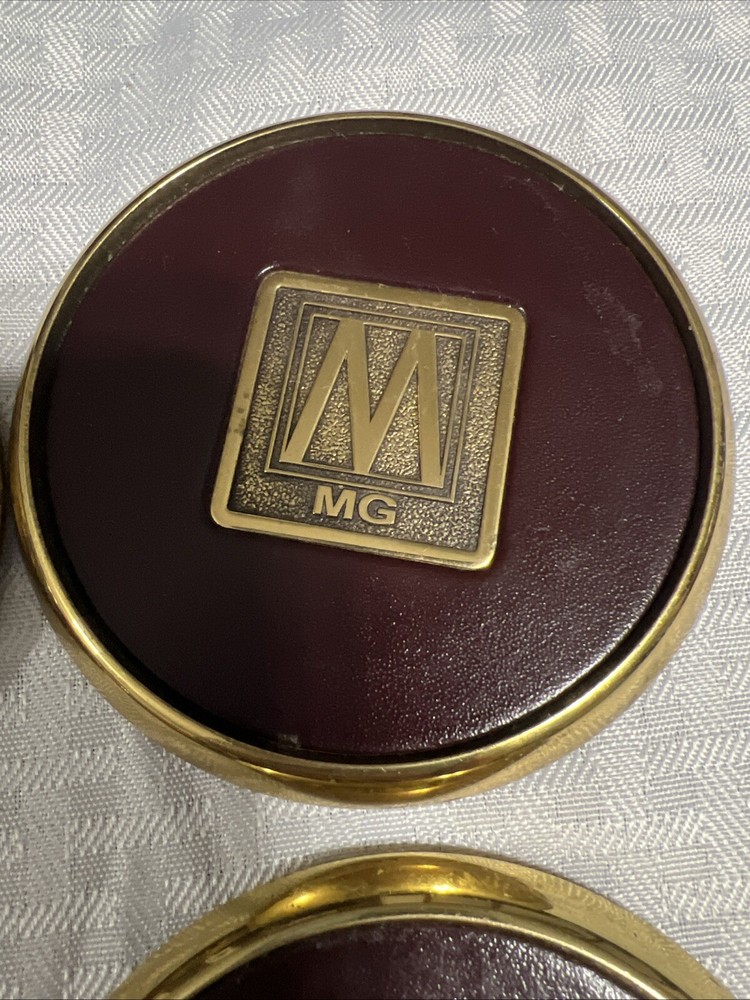 8 Vintage Solid BRASS and Brown LEATHER M MG COASTERS