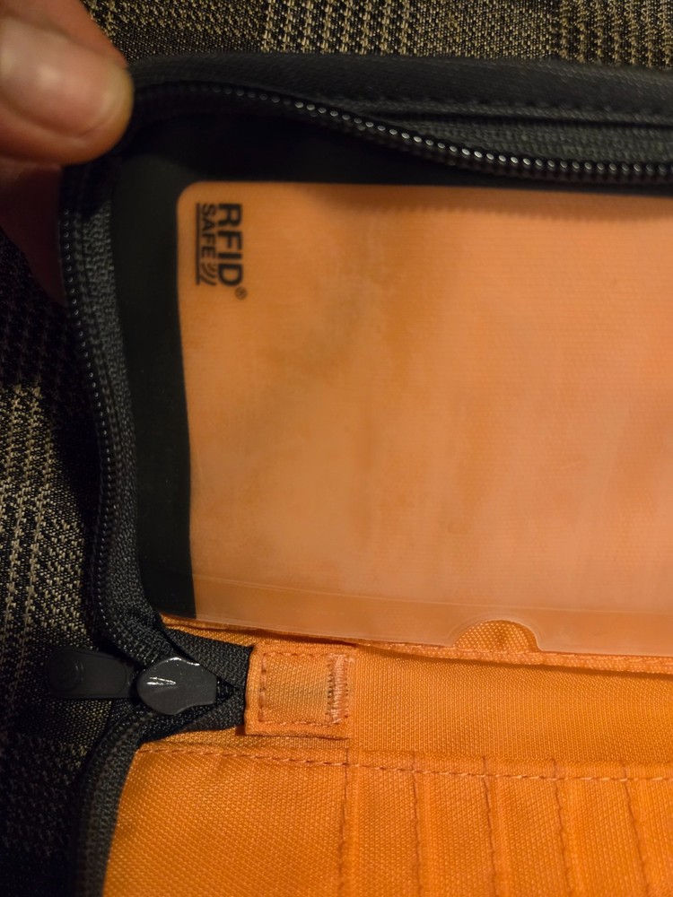 Pacsafe® RFIDsafe™ RFID blocking compact travel organizer, gray (orange inside)
