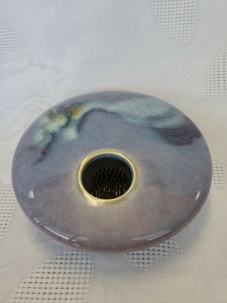 Ceramic single flower bud display vase.