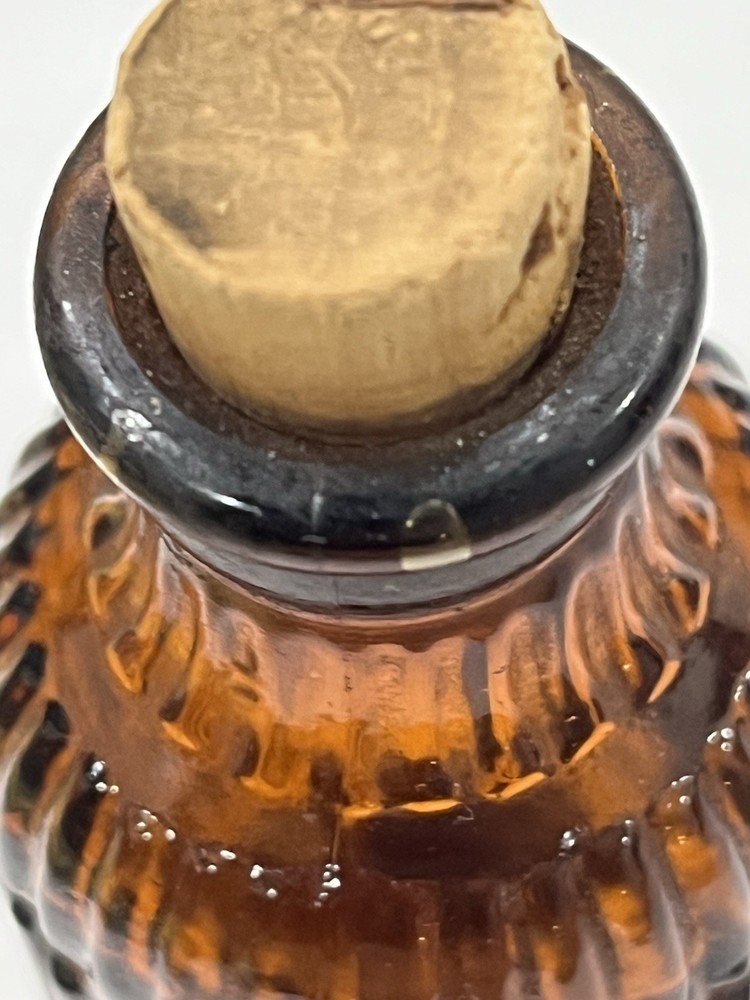 Small Amber Round Ribbed McKESSONS bottle