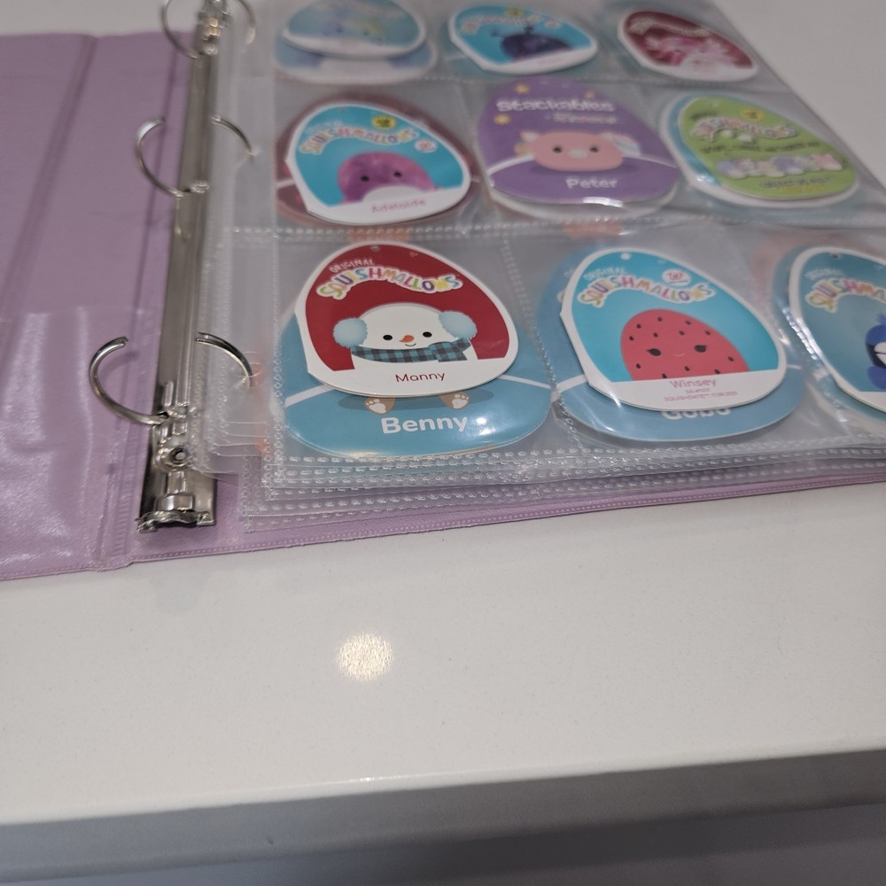 71 Squishmellow Tags In Binder. TAGS ONLY