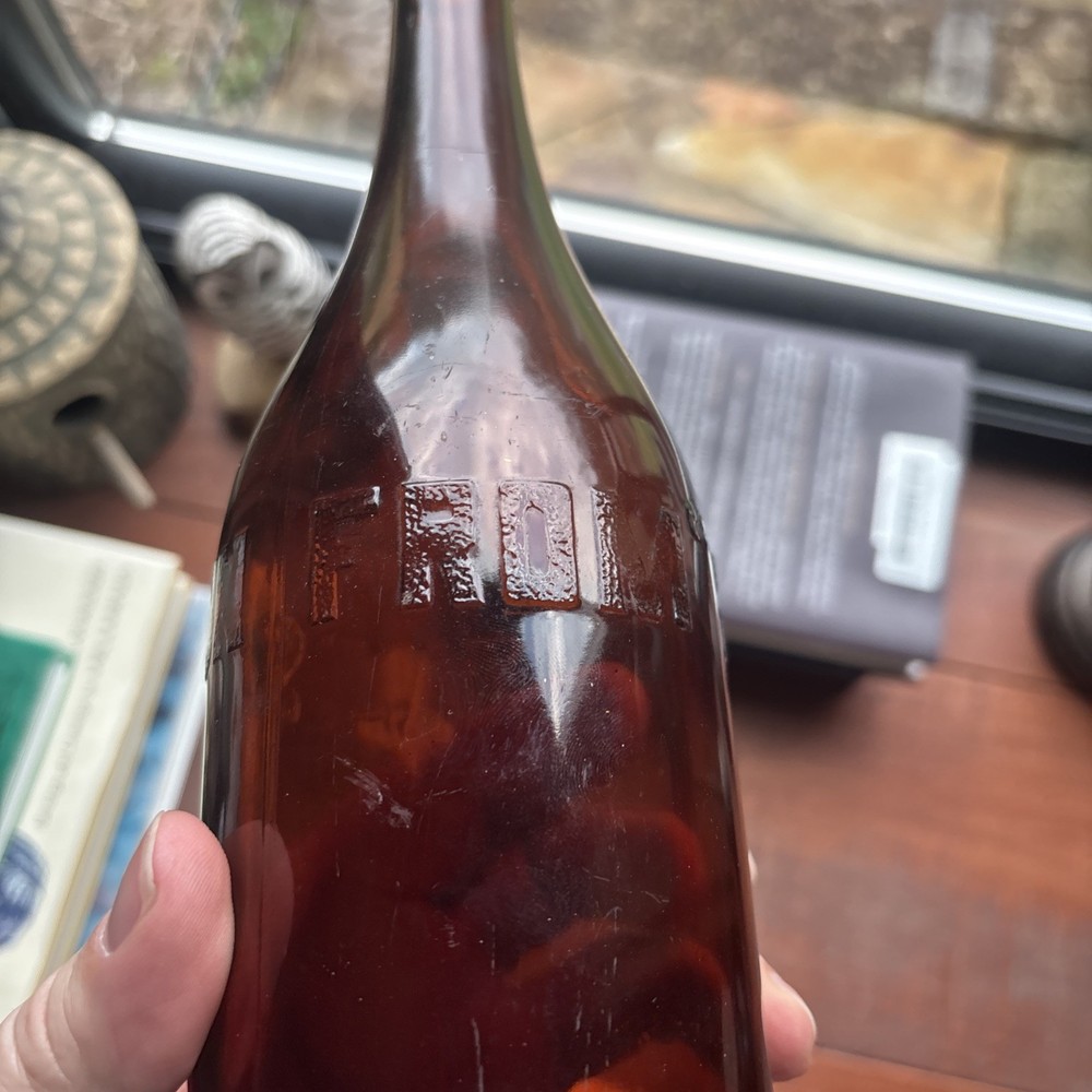 Stains Run From 101 Amber Embossed Bottle