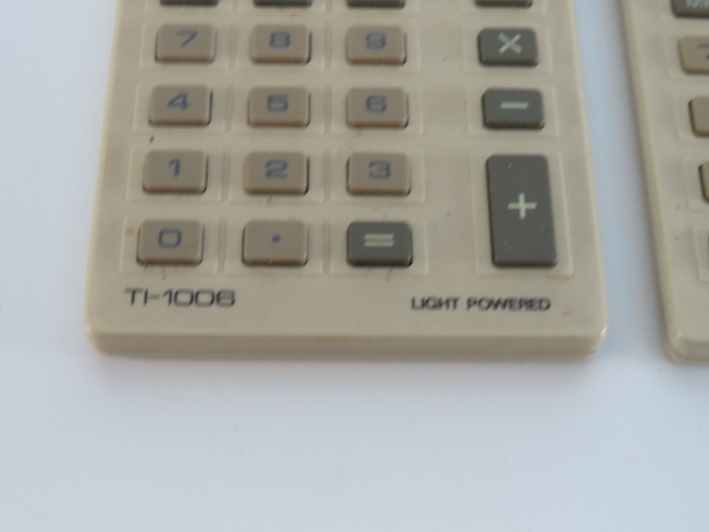 Lot of 2 Texas Instruments TI-1006 Light Powered Calculators Working