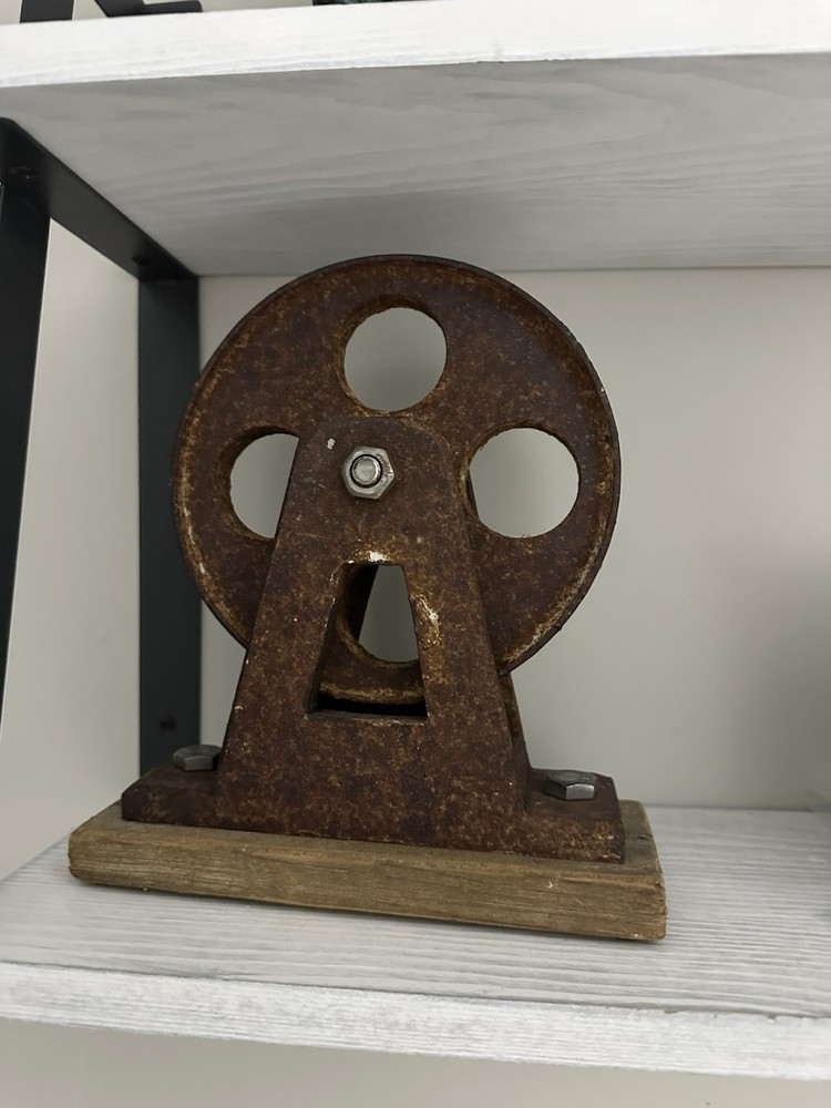 metal wheal on Wooden Base