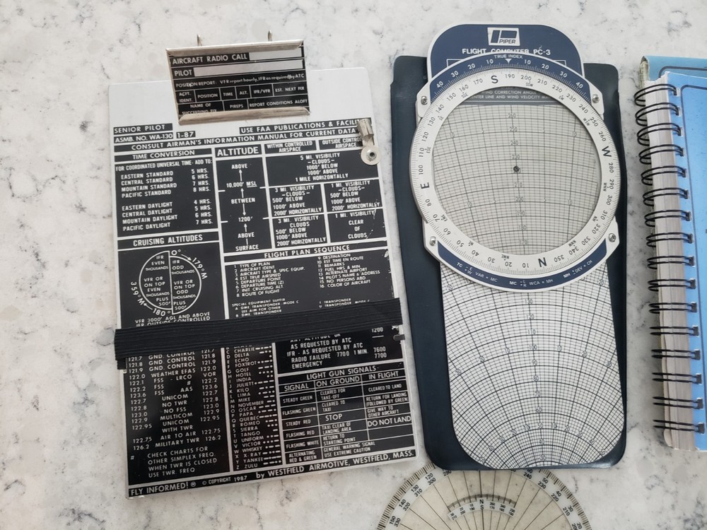 Sporty’s E6B electronic flight computer and Aviation slide computers plates