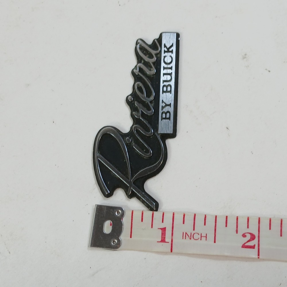 RIVIERA BY BUICK CIRCA '80'S DASH PLASTIC EMBLEM