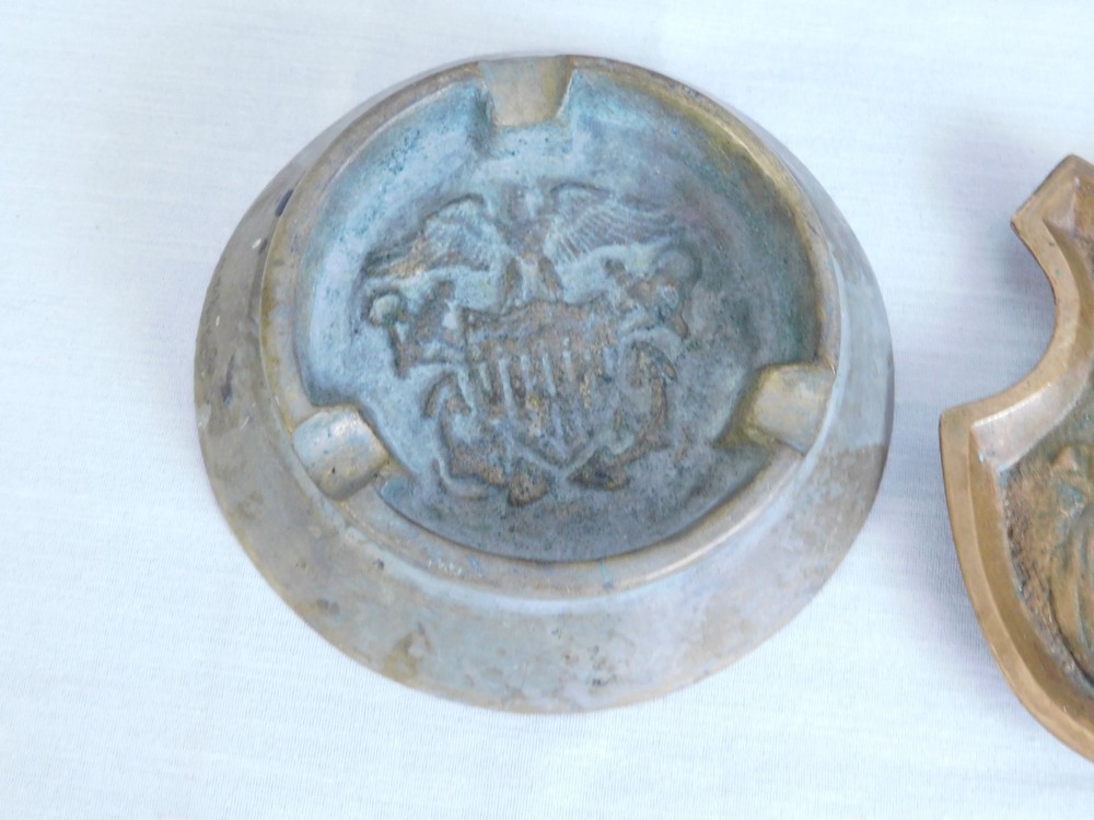 Two Early 20th C. Solid Brass Ashtrays - US Eagle Shield & Naughty Officer