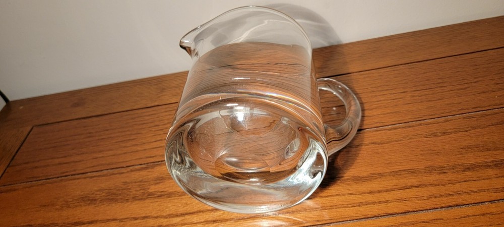 VINTAGE HAND BLOWN GLASS PITCHER WITH APPLIED HANDLE.