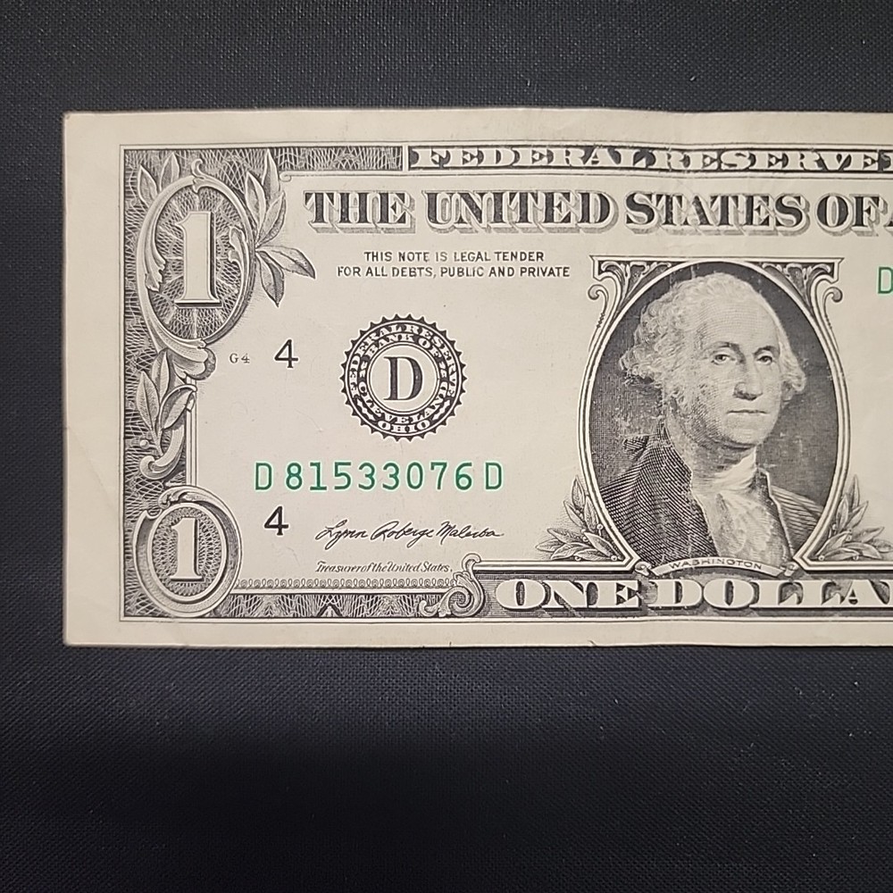 ERROR MISALIGNED MISCUT. ONE DOLLAR BILL