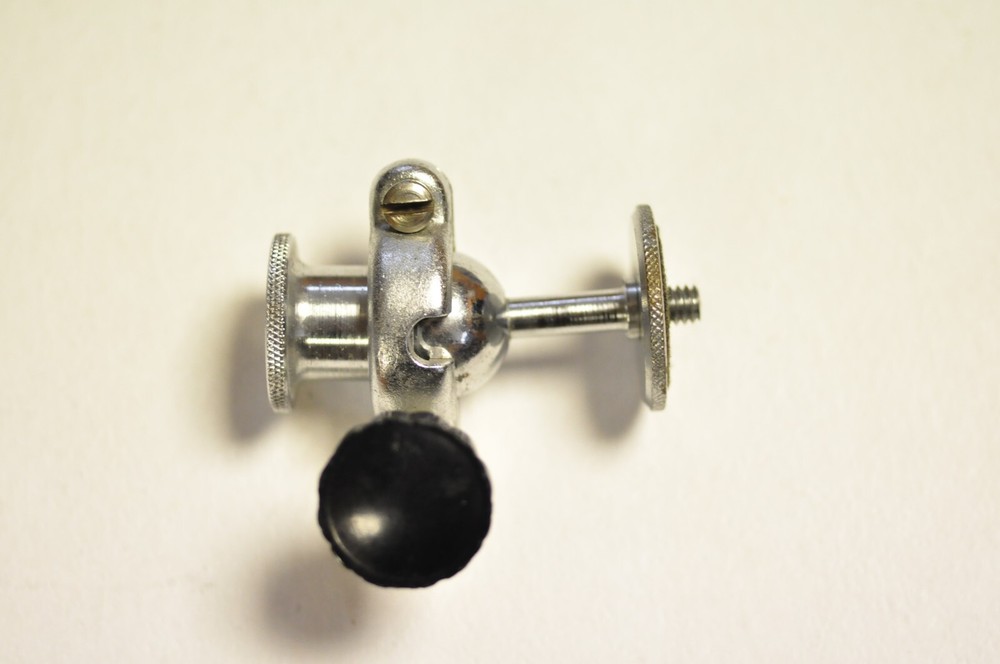 2 1/4" tall ballhead with 1/4" thread at both ends. Well made.