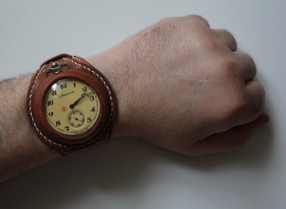 Molniya mechanical watch with a leather strap, wolves