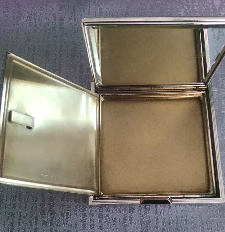 Hallmarked silver compact case with a leather cover