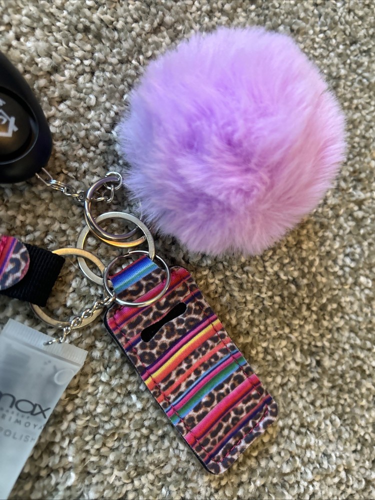 Personal Safety Keychain Set with Several Attached Accessories.