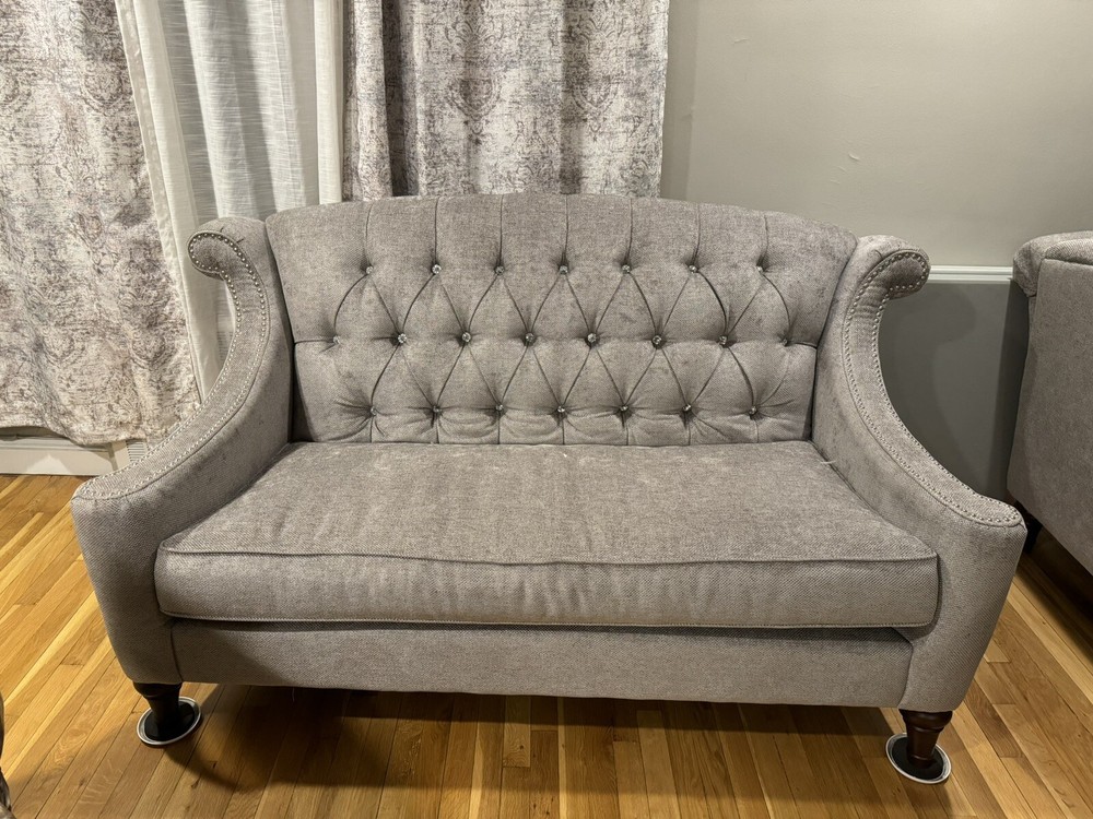 Light grey sofas/ couches.