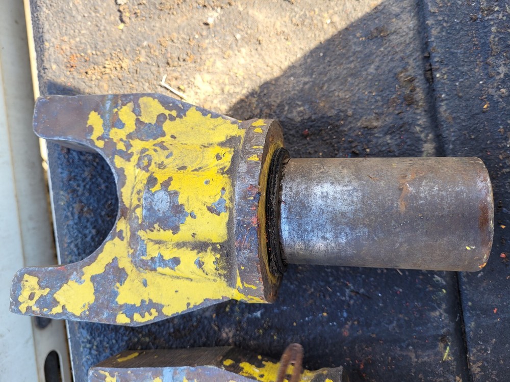 Two Yellow Locking Heavy Equipment Pins Inserts