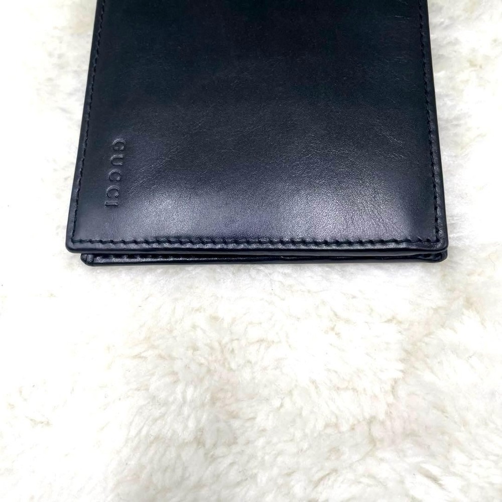 GUCCI Embossed Logo Black Folding Wallet