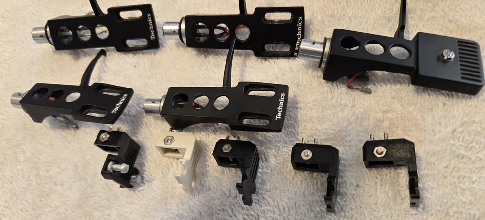 13 Turntable Headshells. 12 OEM Technics, One Pickering. Five P-Mount Adapters