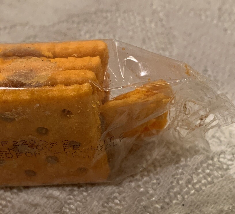 Manufacturing Error Four Pack Of Crackers With Extra Part Of Cracker In Pack