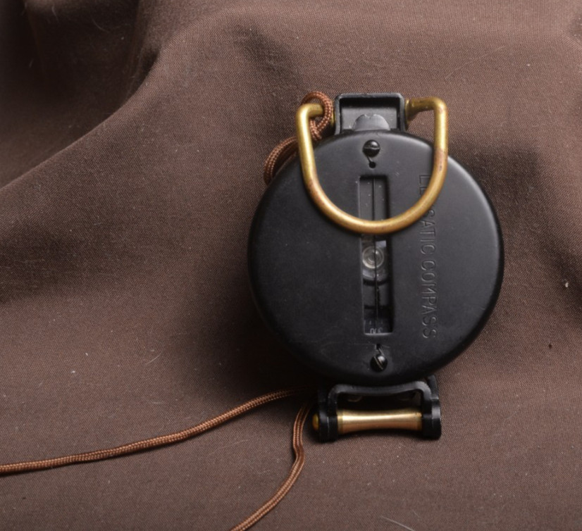 two lensatic compasses one with box